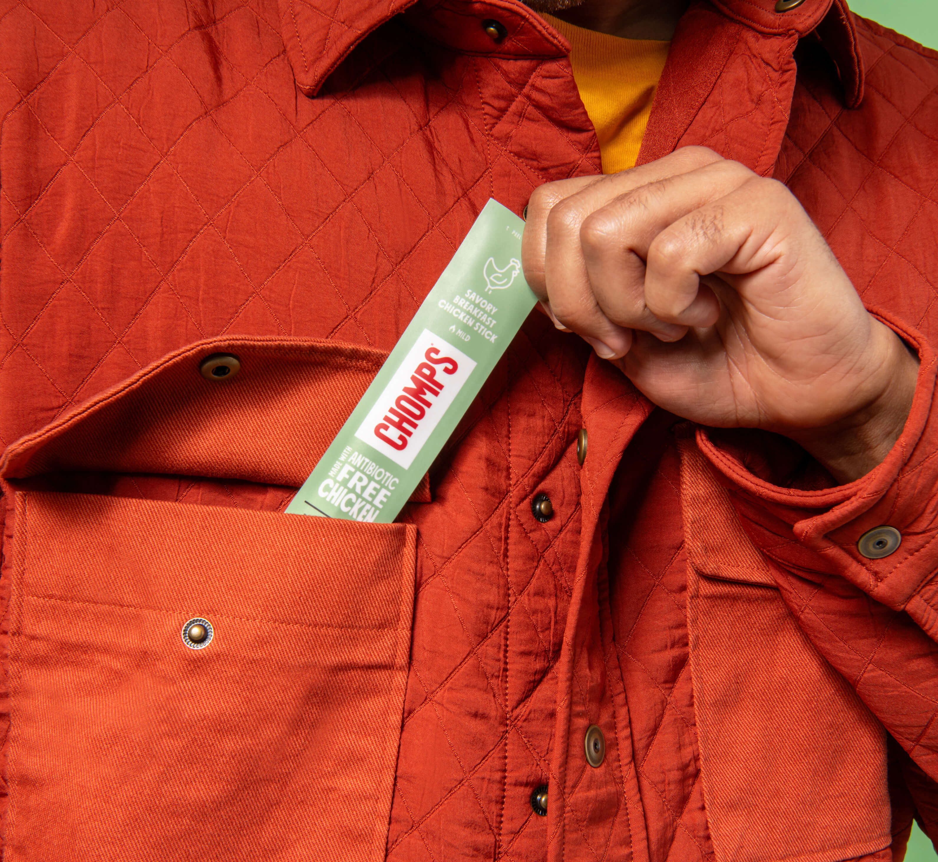 Chomps savory breakfast chicken stick in a jacket pocket