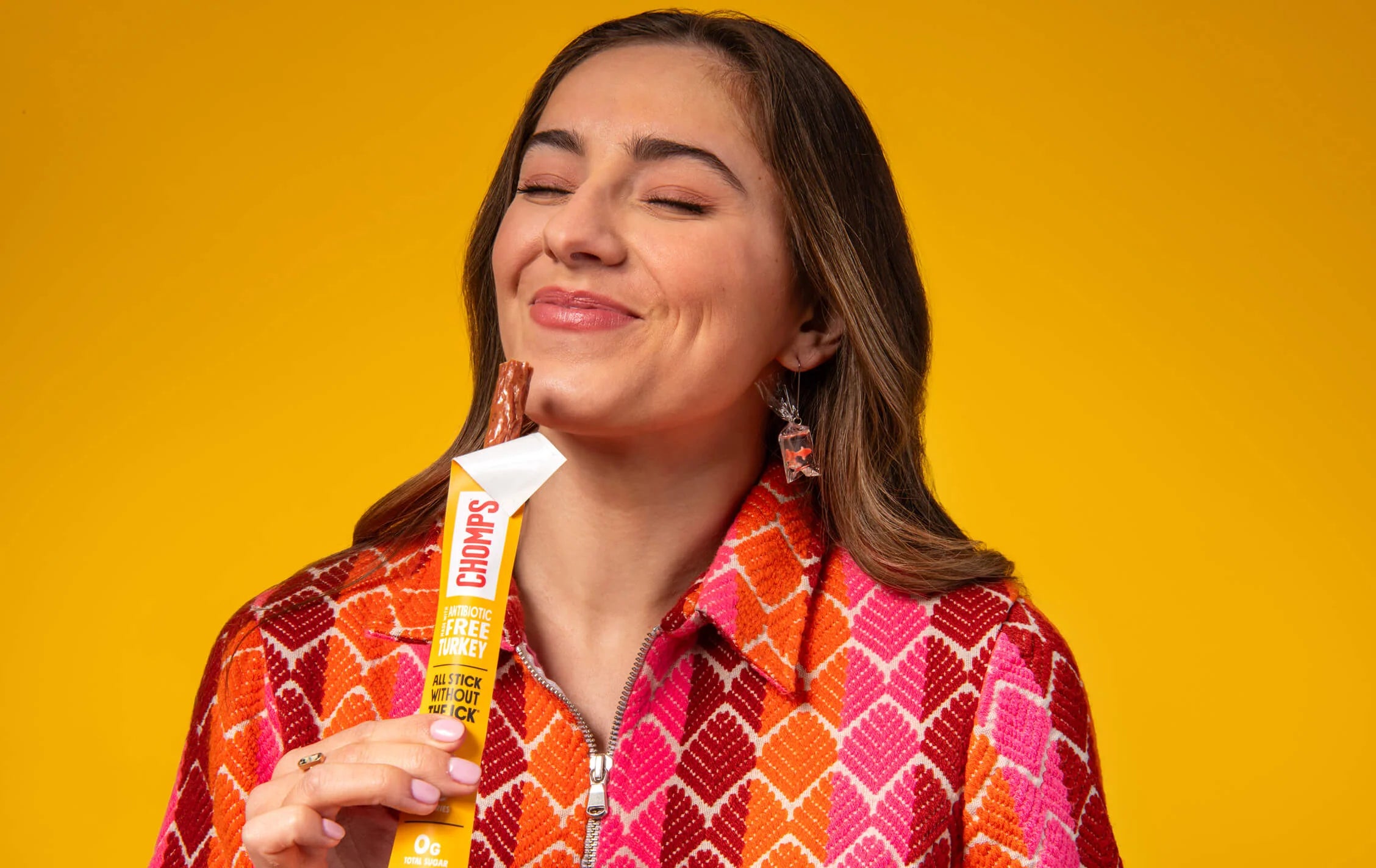 Person enjoying a Chomps meat stick